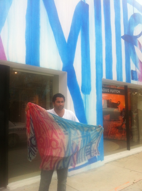 RETNA with a scarf that he designed